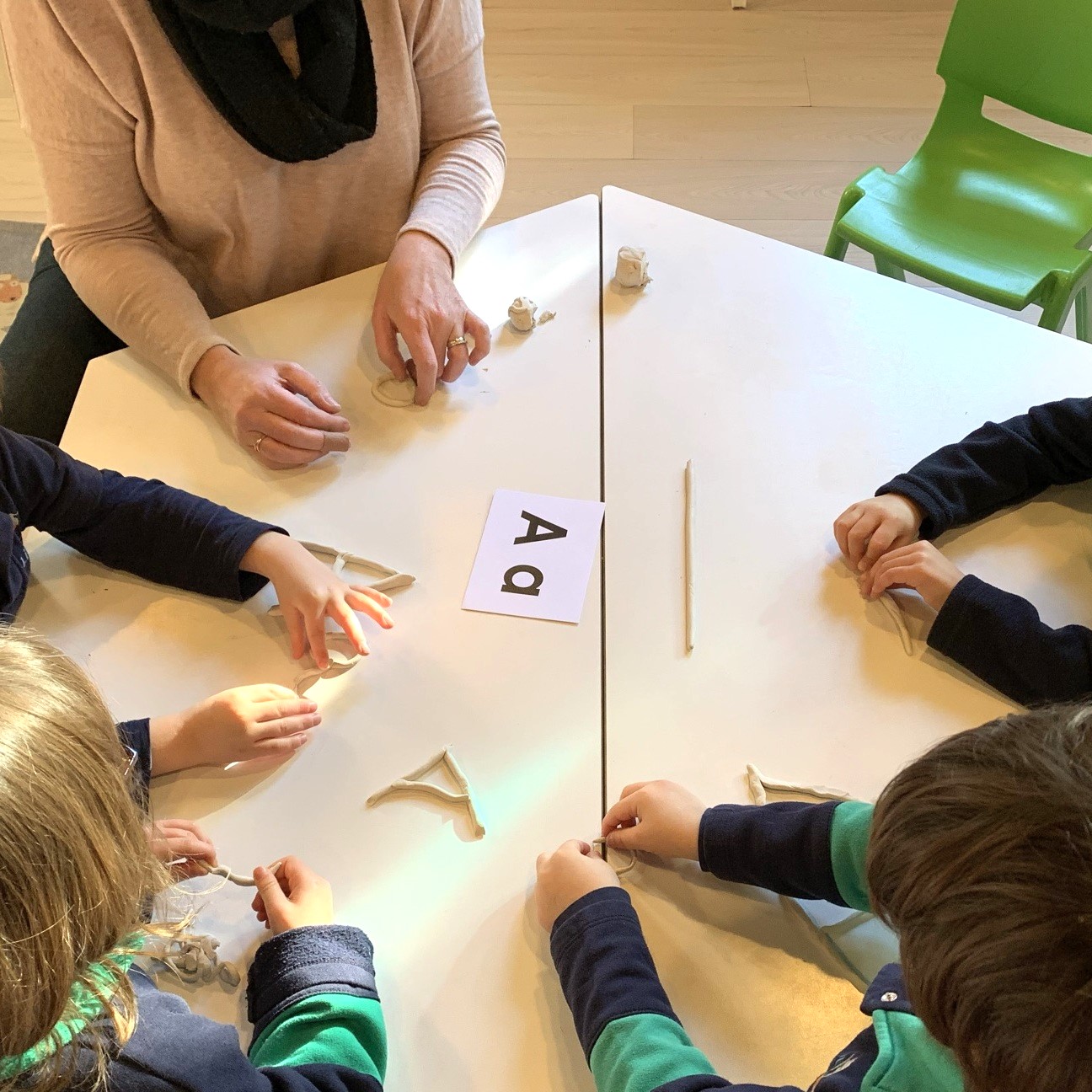 Kindergarten students learning their letters
