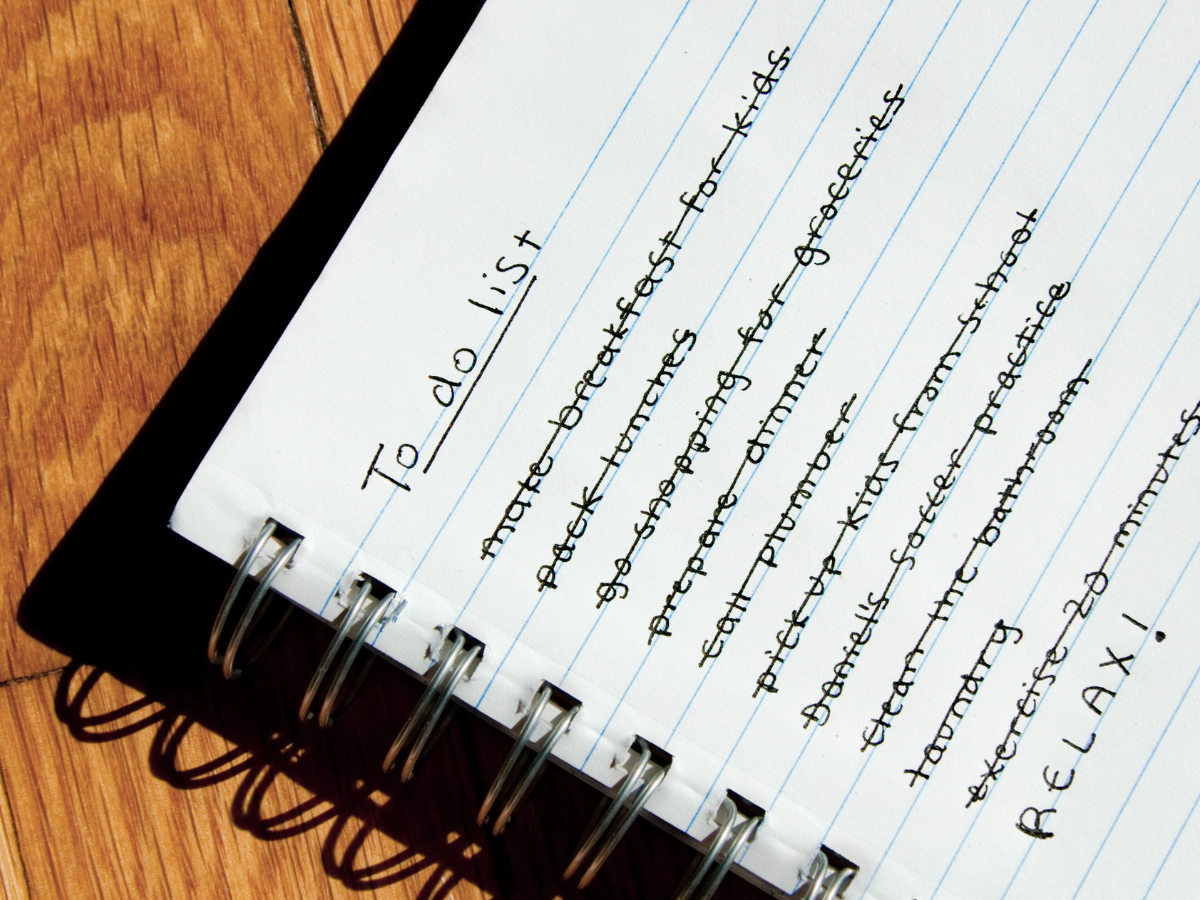 An image of a notebook on a desk, with a To Do list. All items are crossed out, except for RELAX!